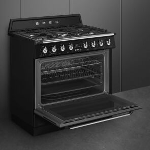 kuchnia-gazowo-elektryczna-smeg-victoria-tr90gmbl-od-lewej-otwarty-piekarnik-pusty.jpg